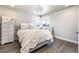 This cozy bedroom is bathed in soft natural light, creating a peaceful atmosphere at 6235 Stable View St, Castle Pines, CO 80108