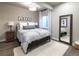 Comfortable bedroom with a large bed, side tables, and a full-length mirror at 6235 Stable View St, Castle Pines, CO 80108
