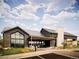 Stunning exterior view of a modern clubhouse with professional landscaping at 6235 Stable View St, Castle Pines, CO 80108