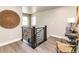 Bright hallway features stylish railing and a decorative wall hanging, adding a modern touch at 6235 Stable View St, Castle Pines, CO 80108