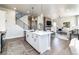 Modern kitchen with white cabinets, stainless steel appliances, and hardwood floors at 6235 Stable View St, Castle Pines, CO 80108
