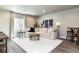 Bright living room with a comfy sectional sofa, area rug, and stylish decor at 6235 Stable View St, Castle Pines, CO 80108