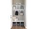 Mudroom features cubbies, hooks, bench, and storage baskets, perfect for organization at 6235 Stable View St, Castle Pines, CO 80108