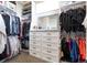 Organized walk-in closet with shelving, hanging rods, and drawers, maximizing storage space and functionality at 6235 Stable View St, Castle Pines, CO 80108