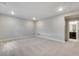The spacious basement has neutral walls and carpet, plus an ensuite bathroom at 3314 N Haleyville Ct, Aurora, CO 80019
