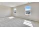 This bedroom offers natural light from the multiple windows, neutral paint, and carpet flooring, providing a serene atmosphere at 3314 N Haleyville Ct, Aurora, CO 80019