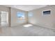 Bright bonus room offering neutral paint, carpet flooring, and natural light, creating an inviting and versatile living space at 3314 N Haleyville Ct, Aurora, CO 80019