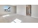 Bright bonus room with neutral paint and plush carpeting is filled with natural light from the many windows at 3314 N Haleyville Ct, Aurora, CO 80019