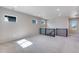 Spacious bonus room with plush carpeting, neutral paint, and abundant natural light from strategically placed windows at 3314 N Haleyville Ct, Aurora, CO 80019