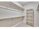 The walk-in closet offers ample storage with installed shelving, ensuring an organized and efficient space at 3314 N Haleyville Ct, Aurora, CO 80019