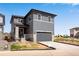 Contemporary two-story home with a attached garage and well-maintained lawn at 3314 N Haleyville Ct, Aurora, CO 80019