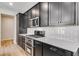 Well-equipped kitchen features stainless steel appliances, modern cabinets, and bright countertops at 3314 N Haleyville Ct, Aurora, CO 80019