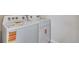 This laundry room includes a side-by-side washer and dryer at 3314 N Haleyville Ct, Aurora, CO 80019
