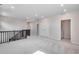 Upstairs loft area with new carpet, lighting, and ample space at 3314 N Haleyville Ct, Aurora, CO 80019