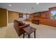 Finished basement area with carpet, recessed lights, an accent wall, and natural lighting at 3173 Gold Yarrow Ln, Evergreen, CO 80439