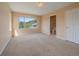 Bedroom featuring a large window and an ensuite bathroom at 3173 Gold Yarrow Ln, Evergreen, CO 80439