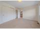 Bedroom with closet space, built-in shelving and easy access to the ensuite bathroom at 3173 Gold Yarrow Ln, Evergreen, CO 80439