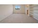 Bedroom featuring neutral colors and a large window with natural light at 3173 Gold Yarrow Ln, Evergreen, CO 80439