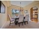 Elegant dining room with mountain view and stylish chandelier for sophisticated dining at 3173 Gold Yarrow Ln, Evergreen, CO 80439