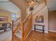 Elegant foyer with hardwood floors, staircase, and views into the living room at 3173 Gold Yarrow Ln, Evergreen, CO 80439