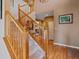 Grand staircase and hardwood floors enhance the foyer's appeal at 3173 Gold Yarrow Ln, Evergreen, CO 80439
