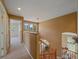 Well-lit hallway with view of downstairs office, blending functionality with elegant design at 3173 Gold Yarrow Ln, Evergreen, CO 80439