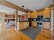 Open kitchen with stainless appliances, granite counters, hardwood floors, and views to living room at 3173 Gold Yarrow Ln, Evergreen, CO 80439