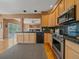 Modern kitchen with stainless steel appliances and granite countertops offers contemporary style at 3173 Gold Yarrow Ln, Evergreen, CO 80439