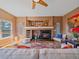 Inviting living area featuring a fireplace and decor, perfect for relaxation at 3173 Gold Yarrow Ln, Evergreen, CO 80439