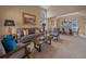 Bright living room with large windows, vaulted ceilings, and a combined dining area at 3173 Gold Yarrow Ln, Evergreen, CO 80439