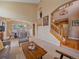 Open-concept living space with views of the foyer, stairs, and dining area at 3173 Gold Yarrow Ln, Evergreen, CO 80439