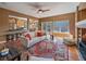 Open living area with hardwood floors, mountain views and cozy fireplace at 3173 Gold Yarrow Ln, Evergreen, CO 80439