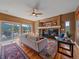 Cozy living room with fireplace, mountain views and access to outdoor deck at 3173 Gold Yarrow Ln, Evergreen, CO 80439