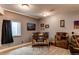 Finished basement featuring a bar area, neutral walls, and carpeted floors at 25120 E Maple Pl, Aurora, CO 80018