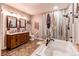 Elegant bathroom with a soaking tub, walk-in shower, and dual vanity sinks at 25120 E Maple Pl, Aurora, CO 80018