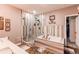 Luxurious bathroom featuring a soaking tub, glass-enclosed shower, and modern fixtures at 25120 E Maple Pl, Aurora, CO 80018