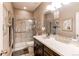Well-appointed bathroom featuring a walk-in shower, spacious vanity, and neutral tile at 25120 E Maple Pl, Aurora, CO 80018