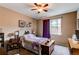 Inviting bedroom with ceiling fan, window, and charming decor for a relaxing atmosphere at 25120 E Maple Pl, Aurora, CO 80018