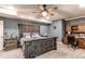 Serene bedroom showcasing a stylish bed, wooden furniture, and ample natural light at 25120 E Maple Pl, Aurora, CO 80018