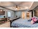 Comfortable bedroom with a ceiling fan, TV, and carpeted floors at 25120 E Maple Pl, Aurora, CO 80018