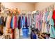 Walk-in closet with ample hanging space and shelving, providing lots of storage solutions at 25120 E Maple Pl, Aurora, CO 80018