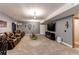 Spacious living room with comfortable leather sofas, a large TV, and stylish decor at 25120 E Maple Pl, Aurora, CO 80018