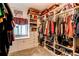 Well-organized walk-in closet with ample storage space and natural light at 25120 E Maple Pl, Aurora, CO 80018