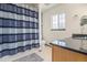 Bathroom featuring shower, vanity, and a well-lit vanity mirror at 14400 Albrook Dr # 43, Denver, CO 80239