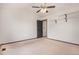 Cozy bedroom includes neutral carpet, ceiling fan and lighting, and modern door accents at 14400 Albrook Dr # 43, Denver, CO 80239