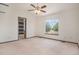 Bright bedroom featuring vaulted ceiling, ceiling fan, and a large window for natural light at 14400 Albrook Dr # 43, Denver, CO 80239