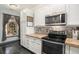Bright kitchen with stainless steel appliances, ample storage, and a decorative window at 14400 Albrook Dr # 43, Denver, CO 80239