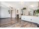 Spacious living room featuring hardwood floors, a cozy fireplace, and a seamless transition to the kitchen at 14400 Albrook Dr # 43, Denver, CO 80239