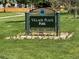 A clear and welcoming sign marks the entrance to Village Place Park at 14400 Albrook Dr # 43, Denver, CO 80239