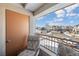 Cozy balcony with comfortable seating offers a serene view of the neighborhood street at 22610 E Ontario Dr # 204, Aurora, CO 80016